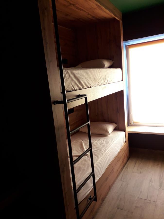 Full House Capsule Hostel Rivne Extérieur photo A bunk bed with a ladder